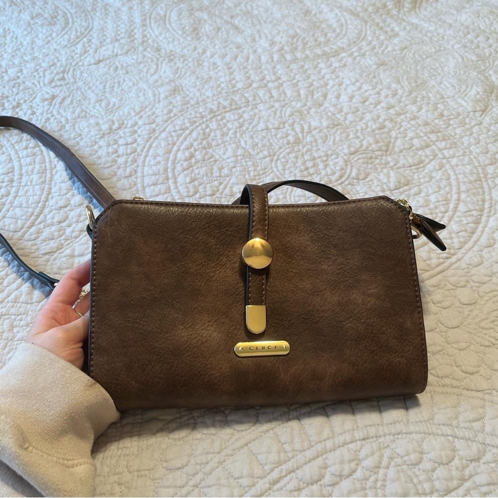 CLUCI Brown Leather Clutch Purse 
Originally $45
Brand new without tags!